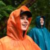 imageCoghlans Adult Rain Poncho Lightweight Waterproof Reusable Hooded Raincoat for Camping Outdoor Activities and TravelOrange Pfasfree